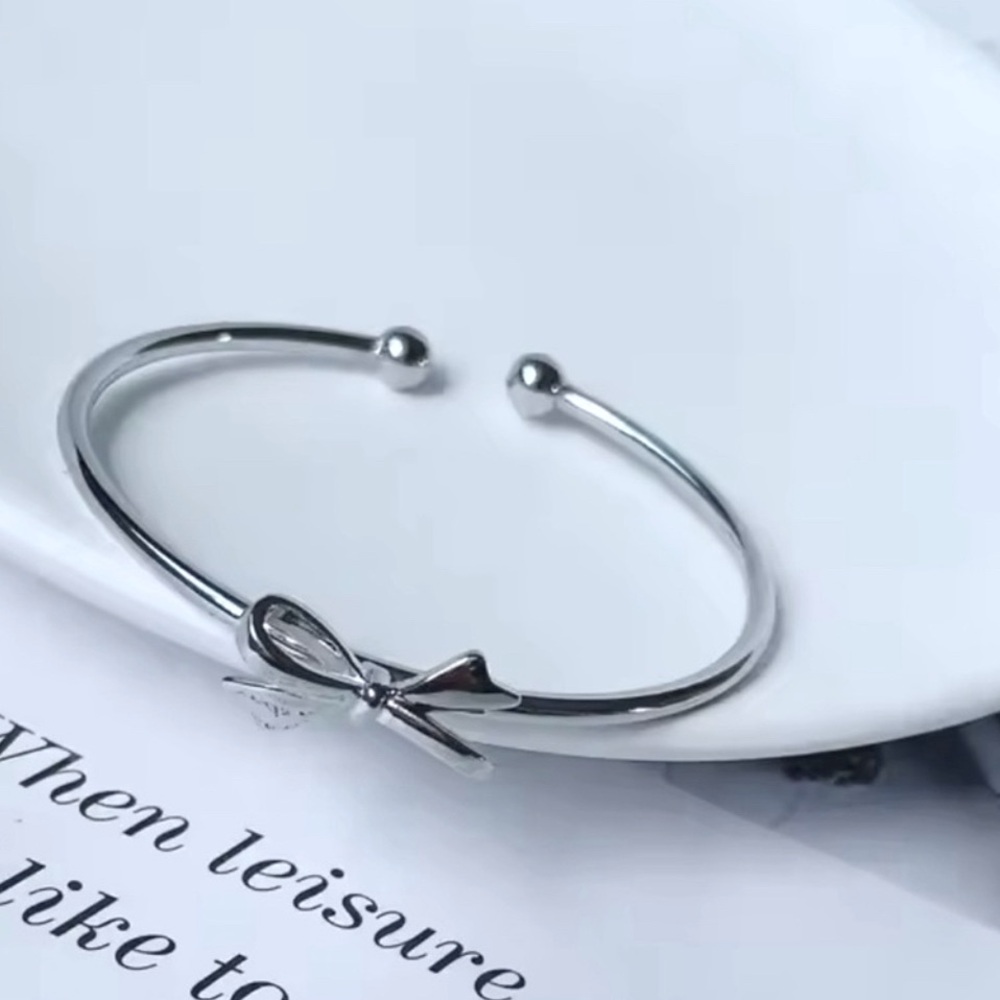 ELEGANT SILVER TONE OPEN DESIGN BOW BRACELET